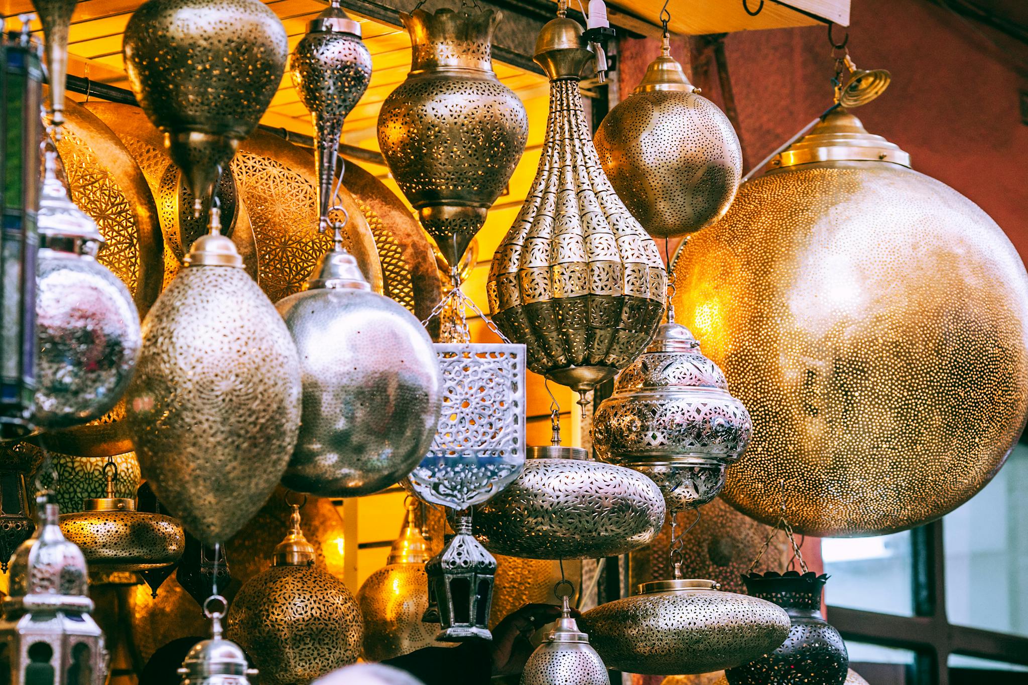 Explore a vibrant display of ornate Oriental lanterns illuminating a bustling bazaar.